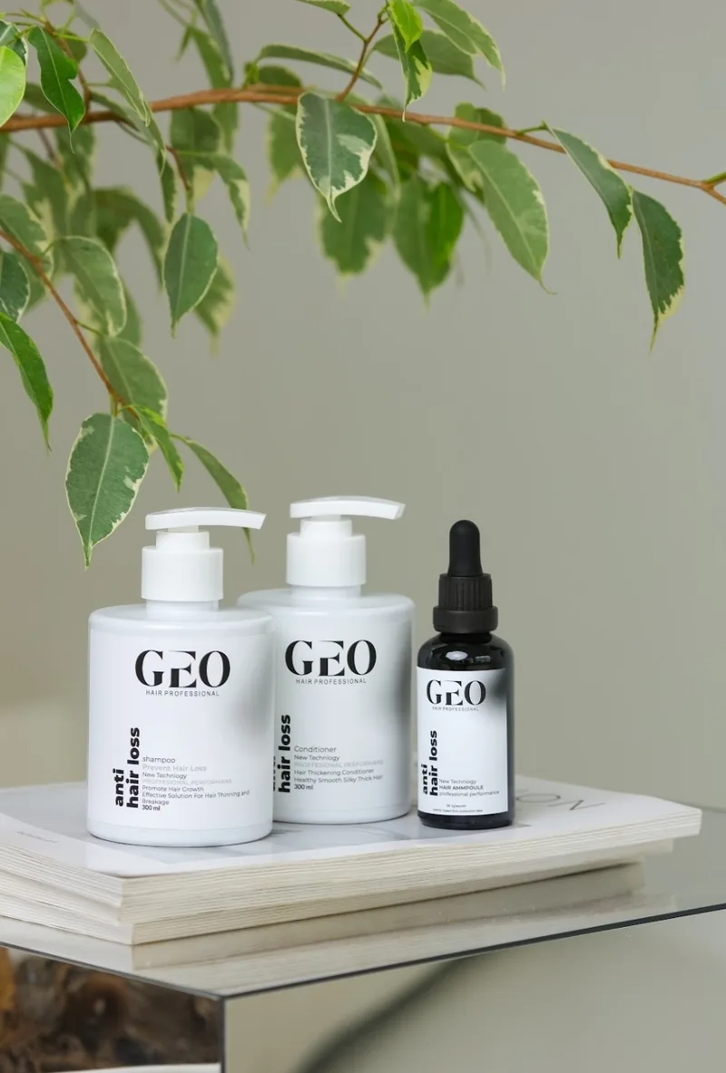 GEO Anti Hair Loss Shampoo and Conditioner (oily hair) with the Anti Hair Loss Ampoule beside a green plant